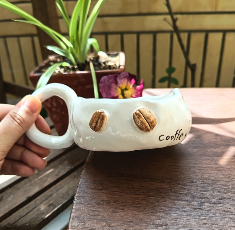 ماگ سرامیکی دست ساز دفرمه طرح قهوه cooffe